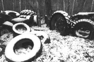 Abandoned pile of used tires outside a sawmill in Palmersville, Tennessee